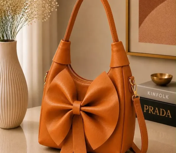 Orange bow shoulder bag for women