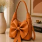 Orange bow shoulder bag for women