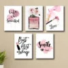 Pink beauty wall art featuring perfume, makeup, roses, and inspirational quotes