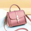 Pink women’s handbag with shoulder strap