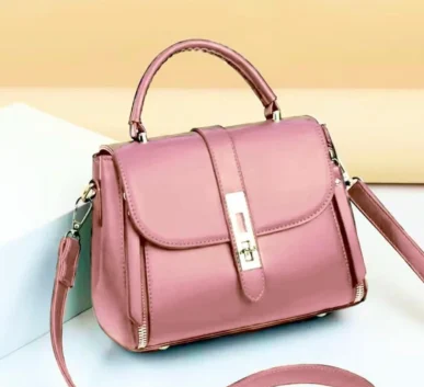Pink women’s handbag with shoulder strap