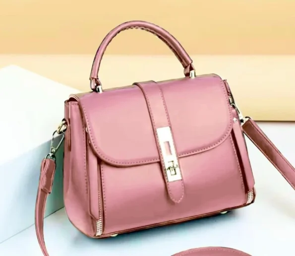 Pink women’s handbag with shoulder strap