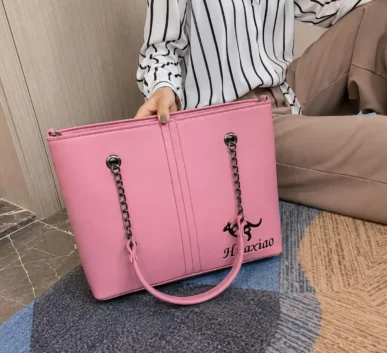 Pink leather shoulder bag for women with chain handles