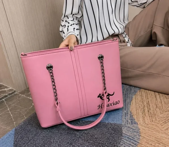 Pink leather shoulder bag for women with chain handles