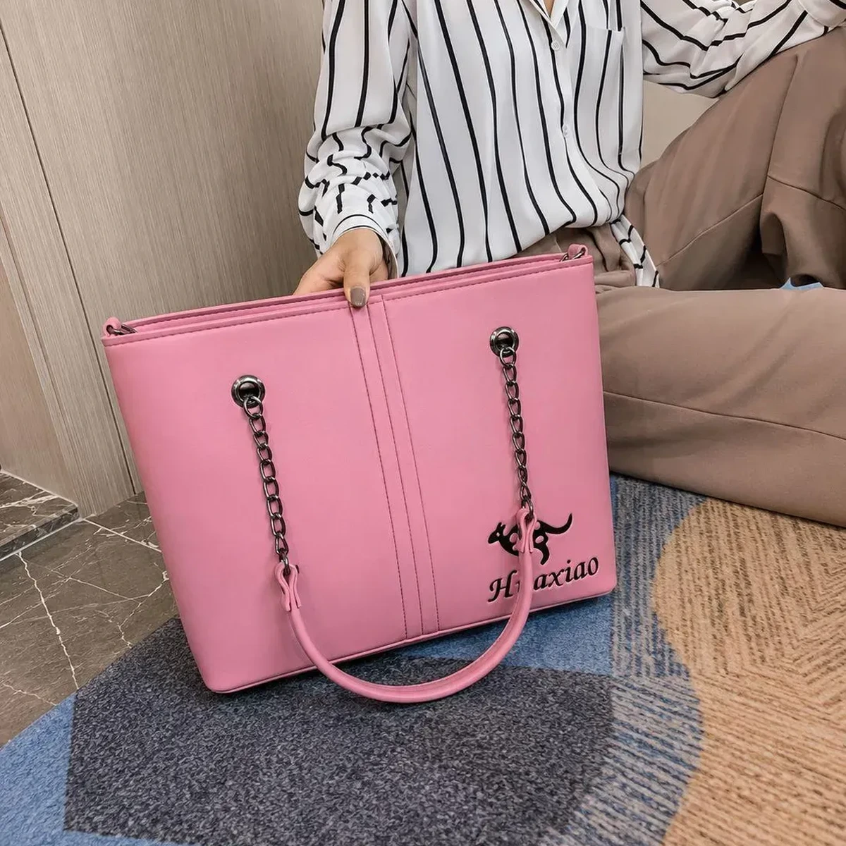 Pink leather shoulder bag for women with chain handles