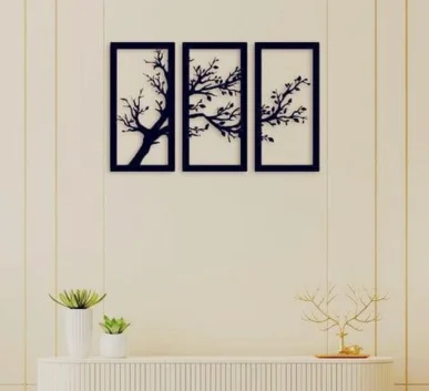 Three-panel black tree branch wall art in a modern living room