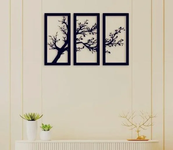 Three-panel black tree branch wall art in a modern living room