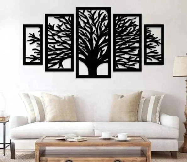 Black tree of life wall art in five-panel design above a white sofa